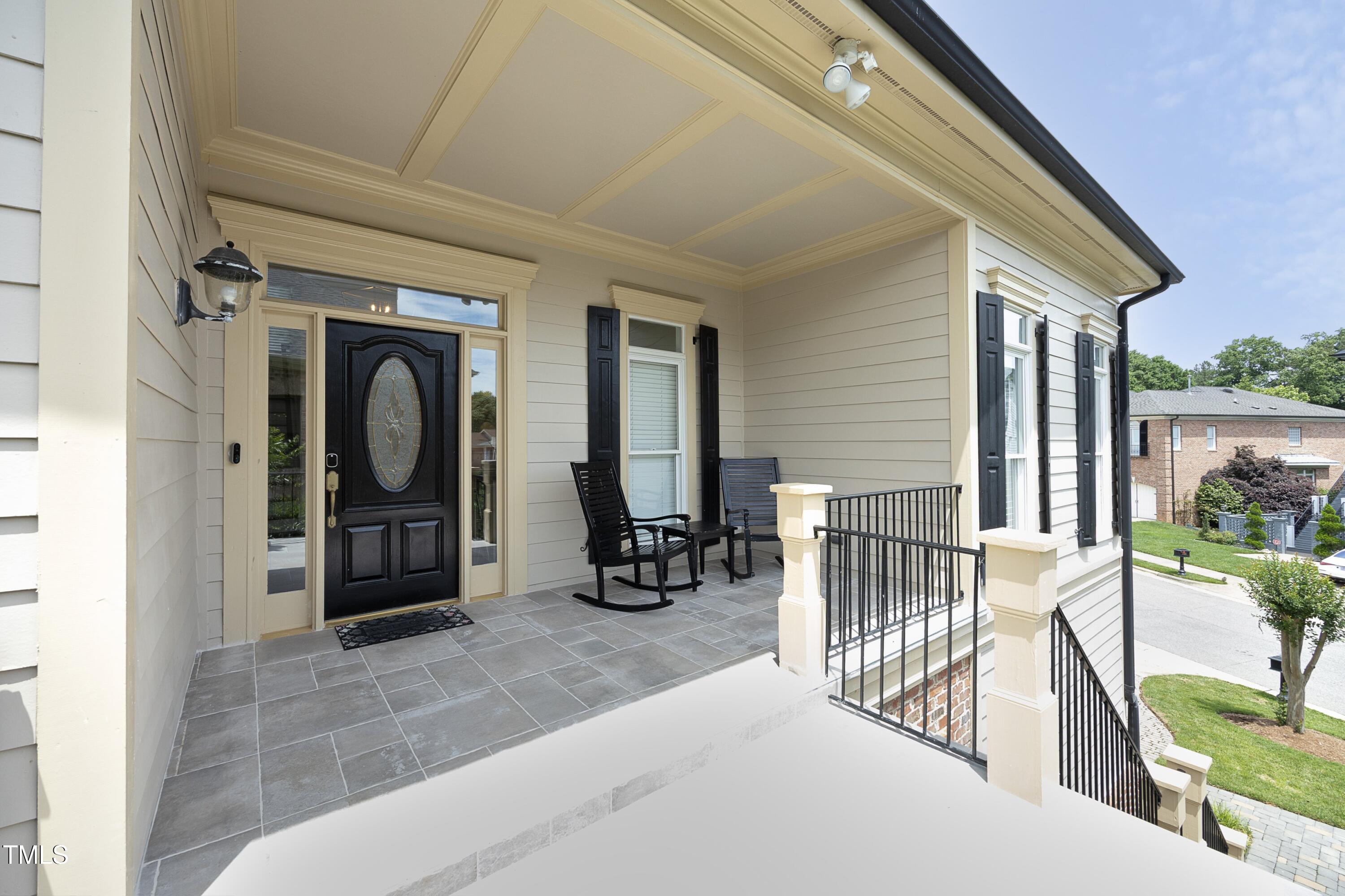 2800 Charleston Oaks Drive Raleigh, NC 27614 - Photo 5 of 53 a view of a porch with furniture and floor to ceiling window