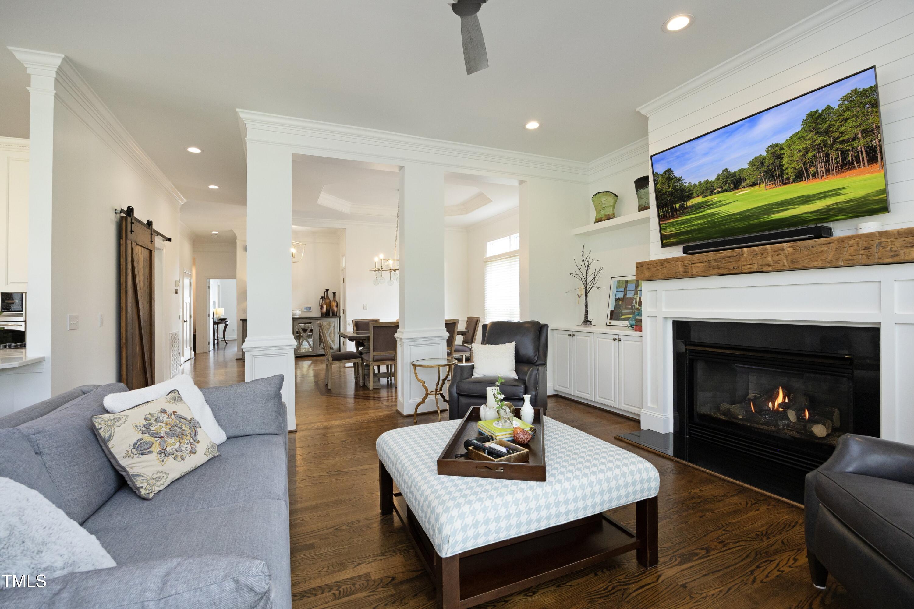 2800 Charleston Oaks Drive Raleigh, NC 27614 - Photo 9 of 53 a living room with furniture and a fireplace