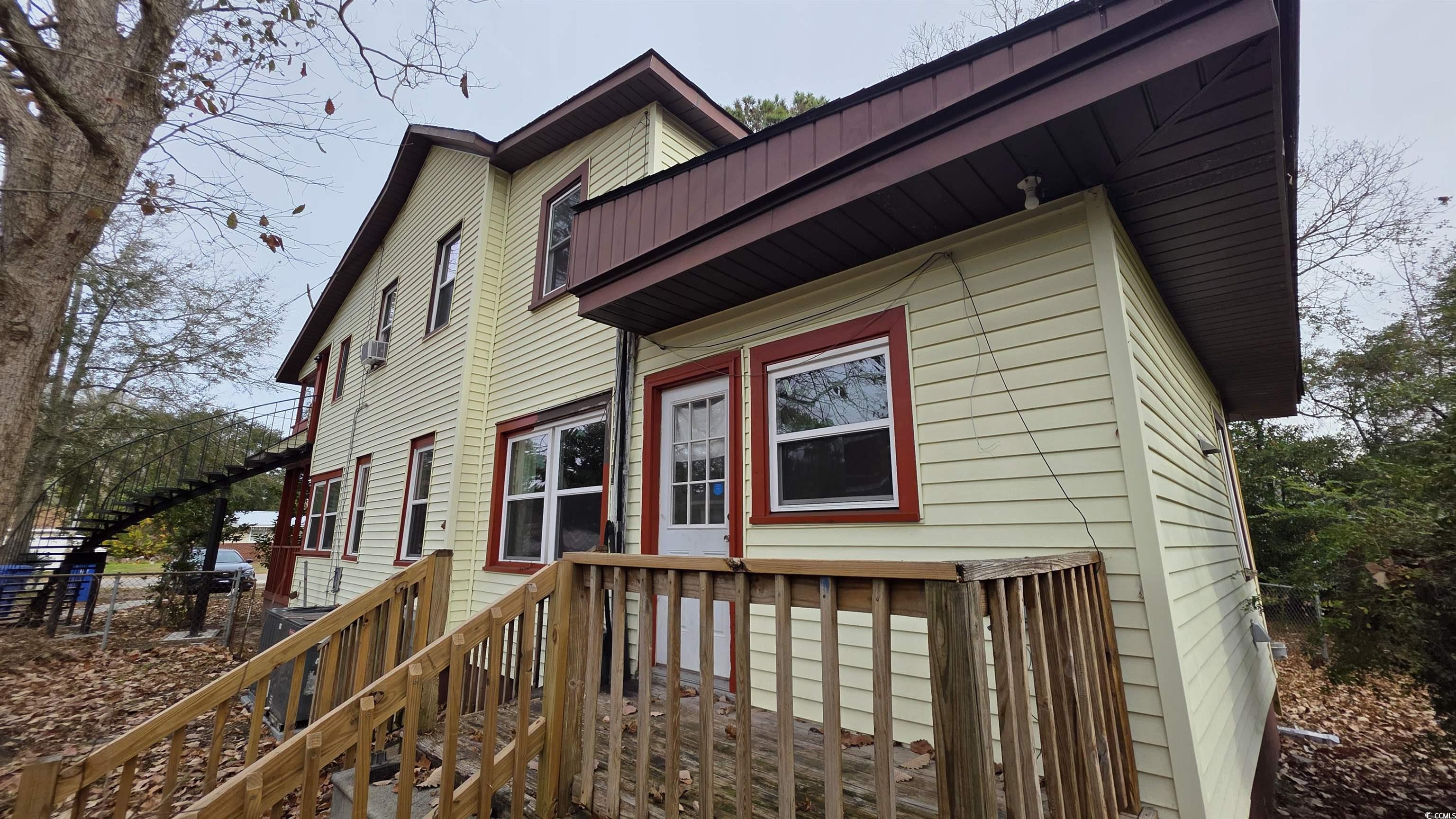 665 Martin Street Myrtle Beach, SC 29577 - Photo 6 of 7 View of side of property with a deck and stairs