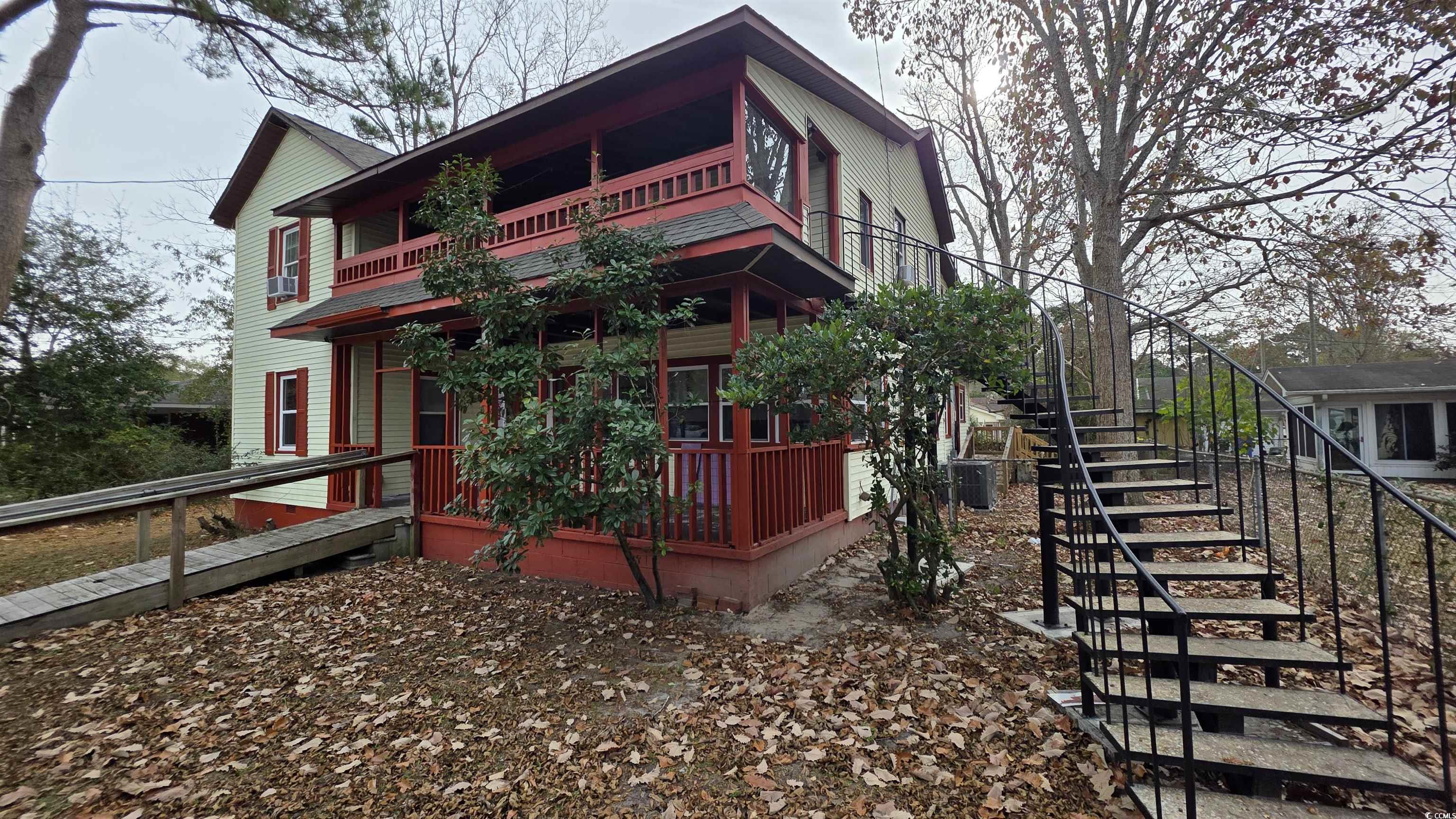 665 Martin Street Myrtle Beach, SC 29577 - Photo 7 of 7 View of side of property featuring stairs and a balcony