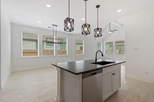 a bathroom with a sink and chandelier