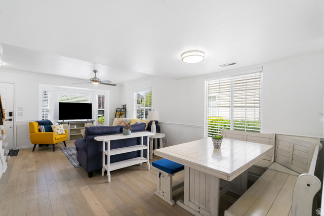732 North 200 E Street Springville, UT 84663 - Photo 12 of 36 Open-concept living and dining area featuring wood-finish flooring, a bay window with blinds