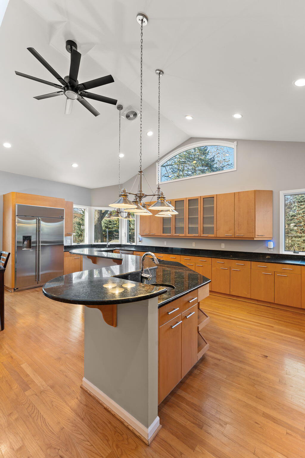 1841 Lambert Lane Munster, IN 46321 - Photo 13 of 66 a kitchen with stainless steel appliances granite countertop a sink a stove and a wooden floor