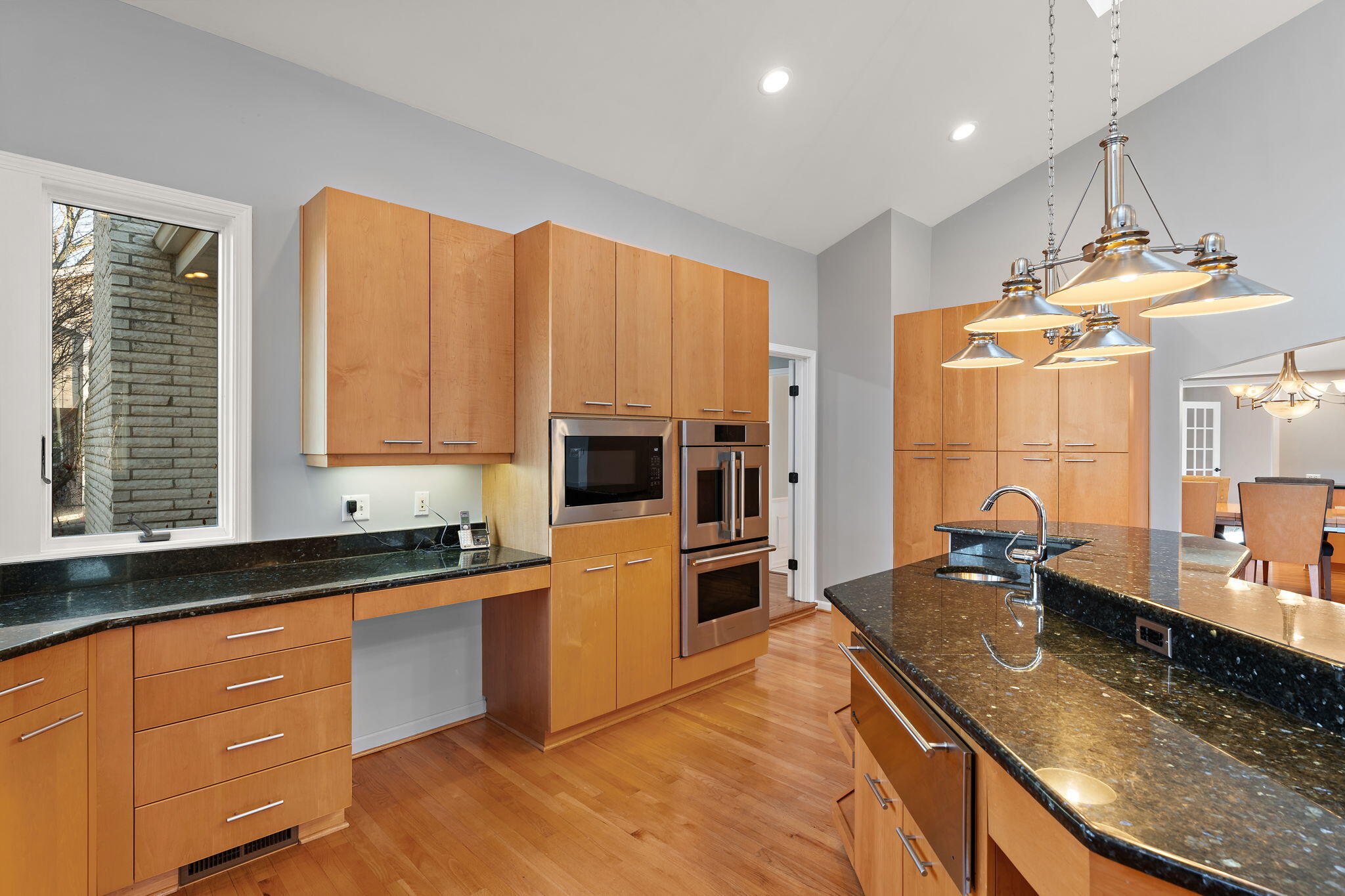 1841 Lambert Lane Munster, IN 46321 - Photo 15 of 66 a kitchen with stainless steel appliances granite countertop a sink a stove and a wooden cabinets