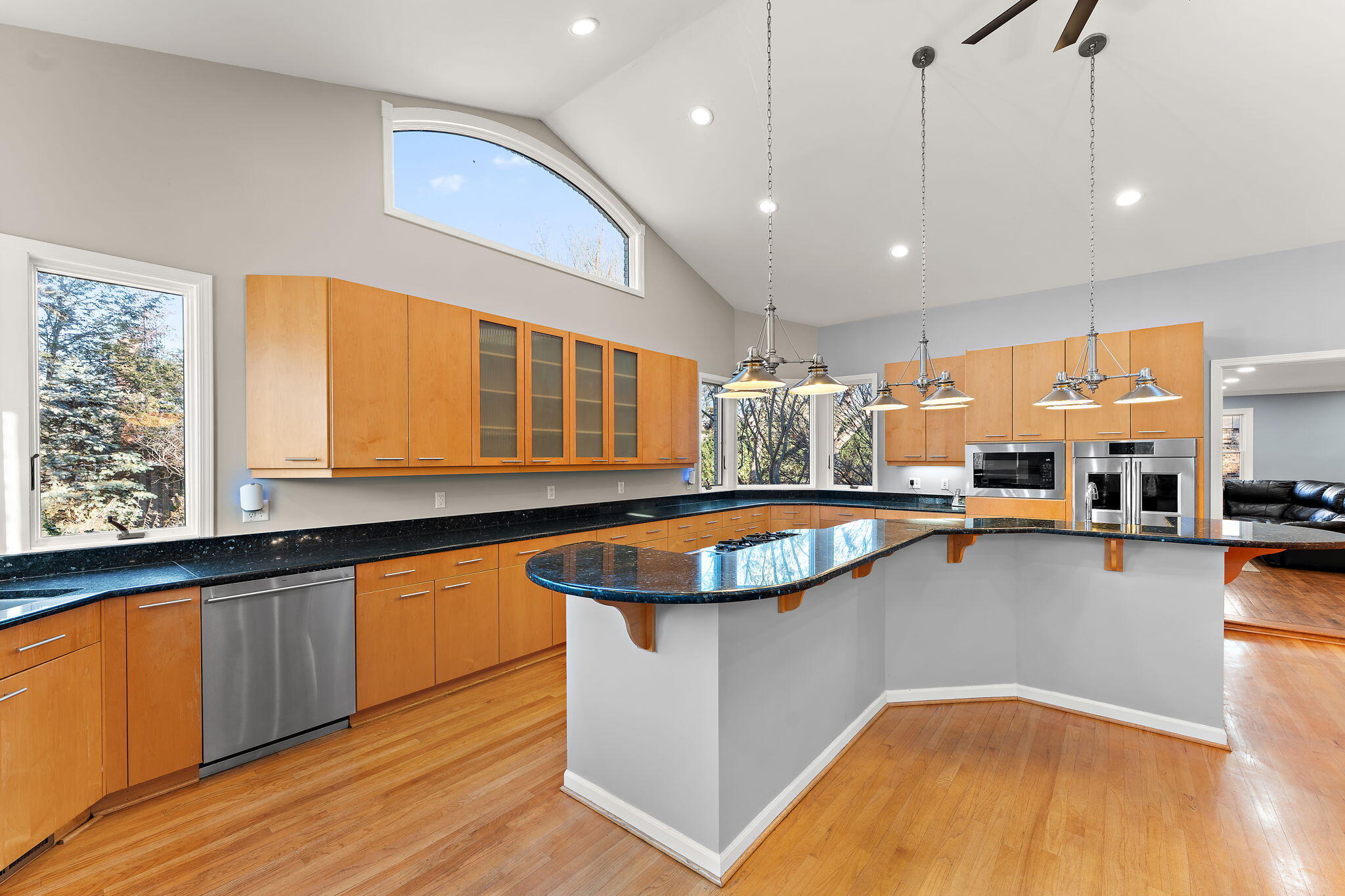 1841 Lambert Lane Munster, IN 46321 - Photo 21 of 66 a view of a kitchen with kitchen island a large counter top space a sink stainless steel appliances and windows