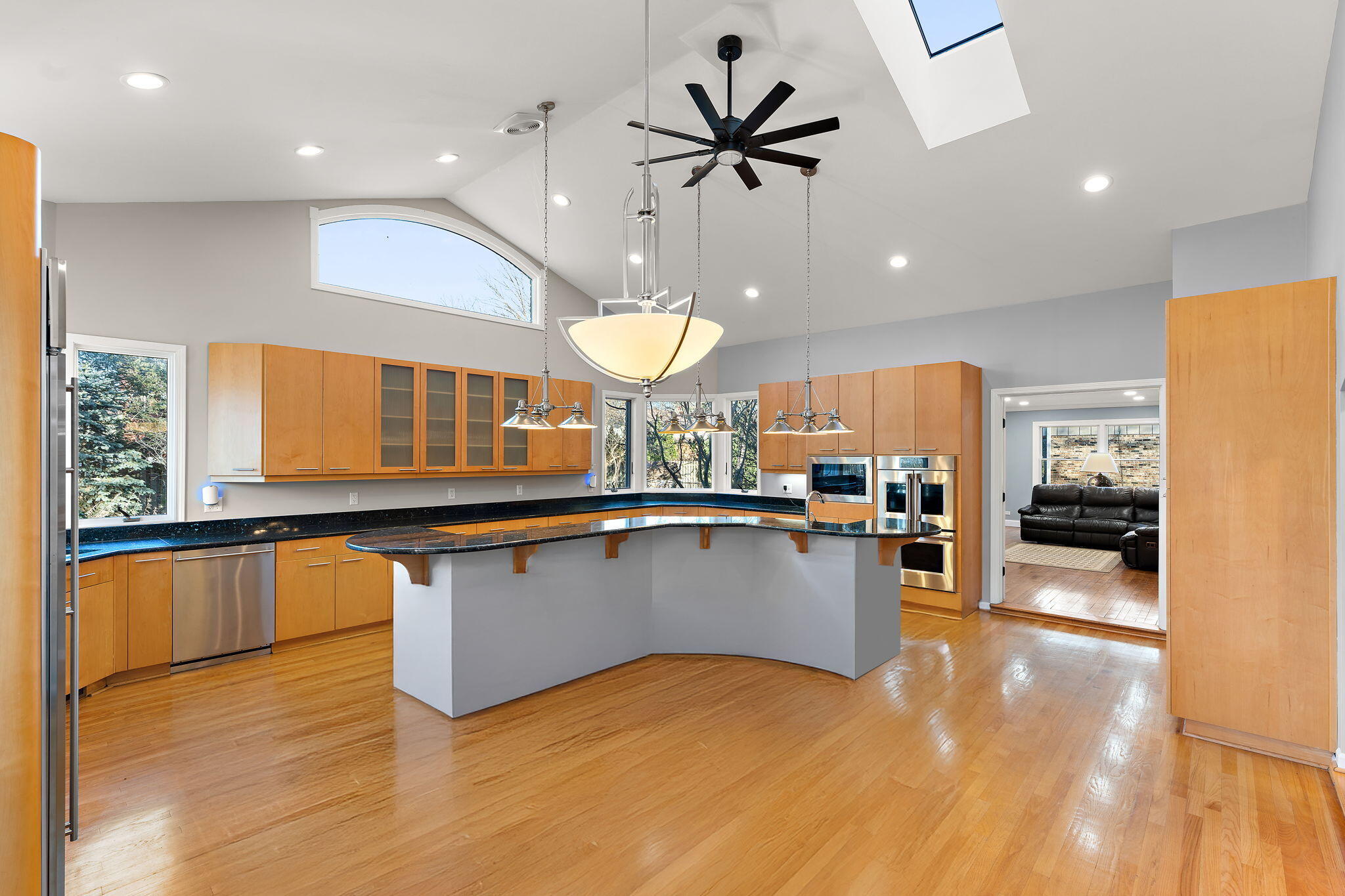1841 Lambert Lane Munster, IN 46321 - Photo 23 of 66 a kitchen with stainless steel appliances a large counter top a stove a sink a refrigerator and a microwave