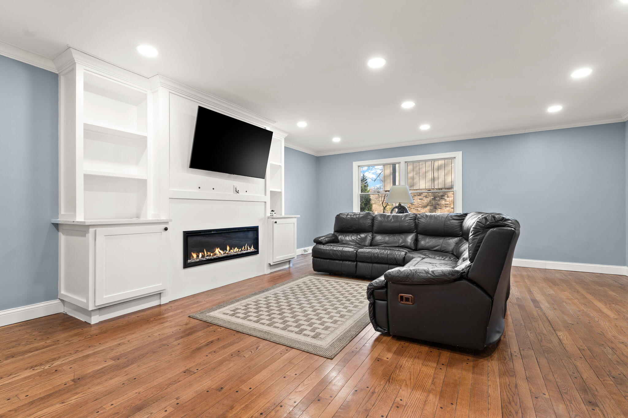 1841 Lambert Lane Munster, IN 46321 - Photo 39 of 66 a living room with furniture and a fireplace