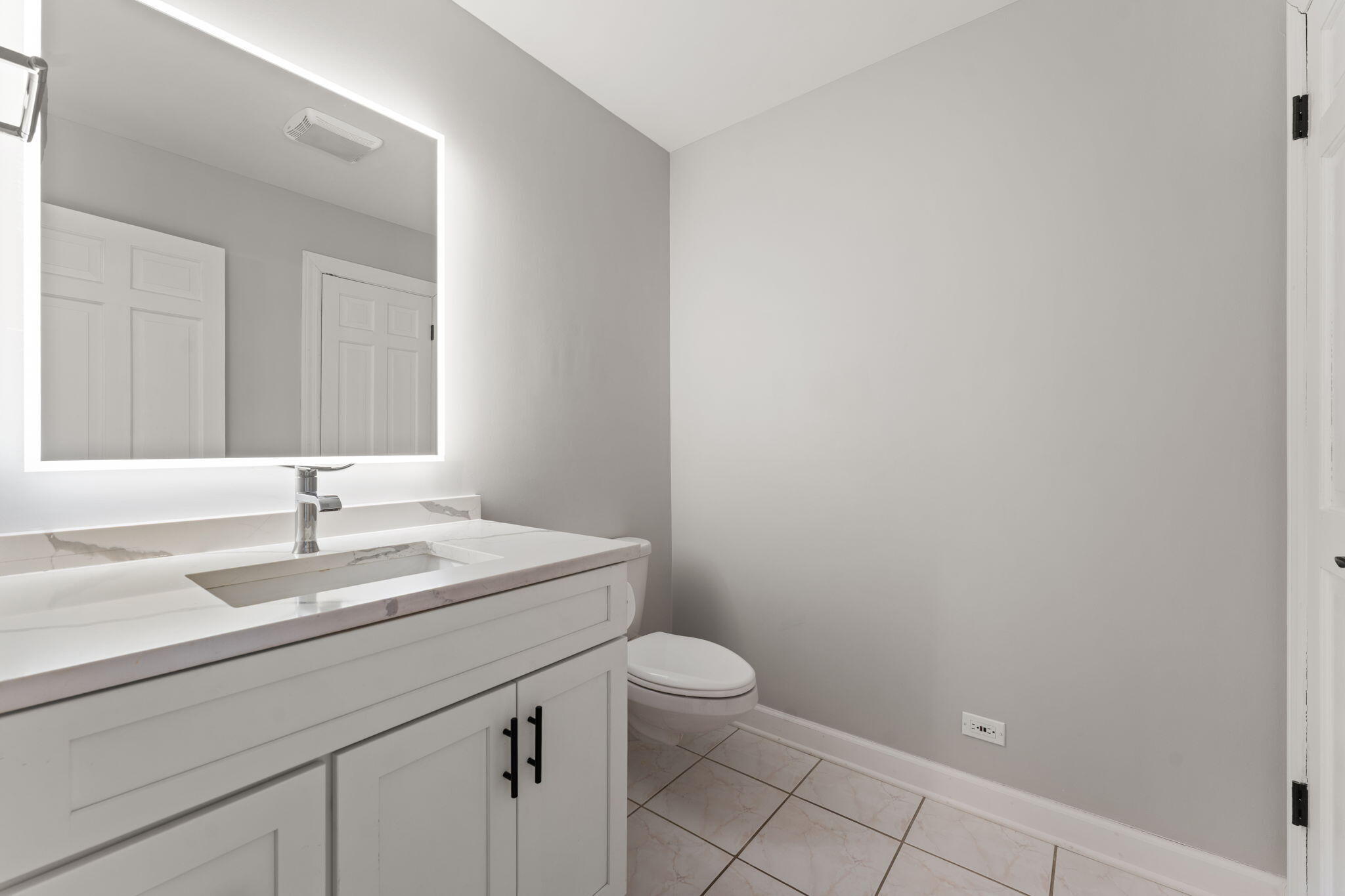 1841 Lambert Lane Munster, IN 46321 - Photo 41 of 66 a bathroom with a sink a toilet and a mirror