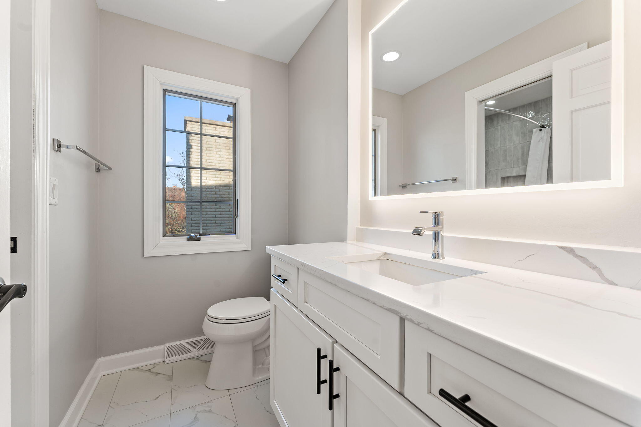 1841 Lambert Lane Munster, IN 46321 - Photo 55 of 66 a bathroom with a sink a toilet and a window