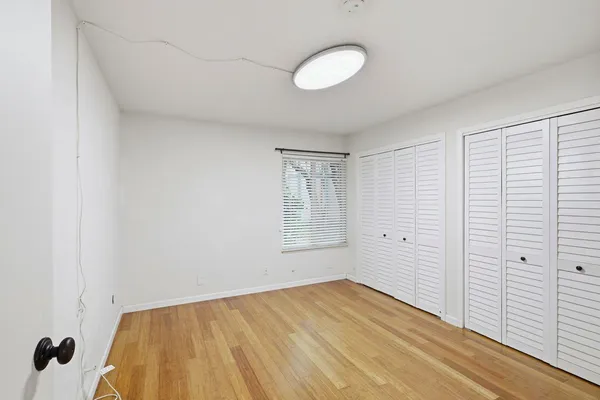 a view of hallway with wooden floor