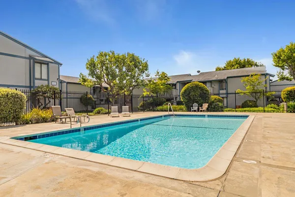 a view of a swimming pool with a lounge chairs