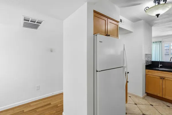 a kitchen with a sink a stove and cabinets