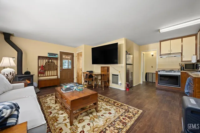 a bedroom with double bed and a chandelier