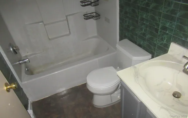 a bathroom with a sink and toilet