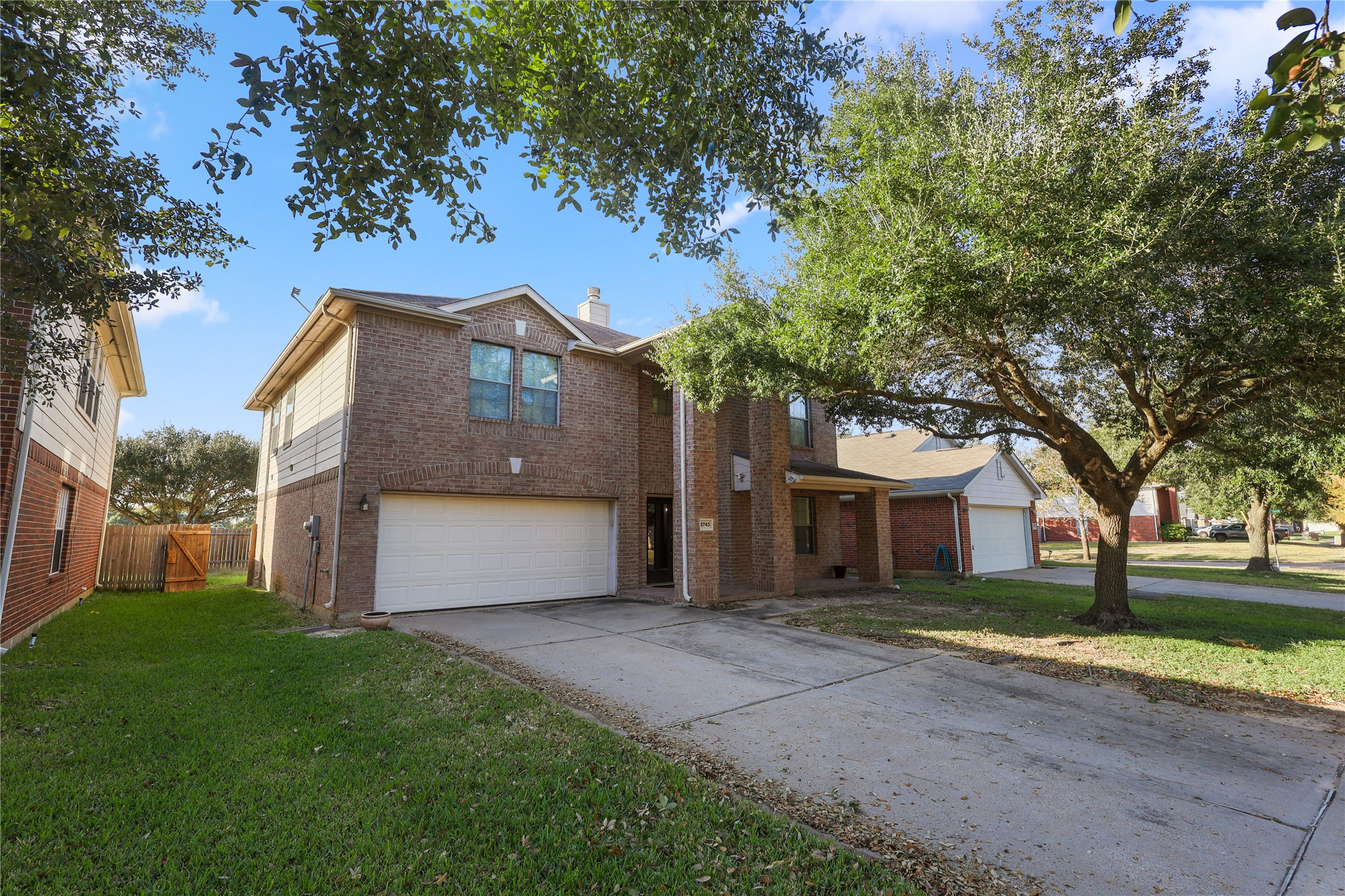 3743 Brighton Springs Lane Katy, TX 77449 - Photo 1 of 40 a front view of a house with a garden and trees