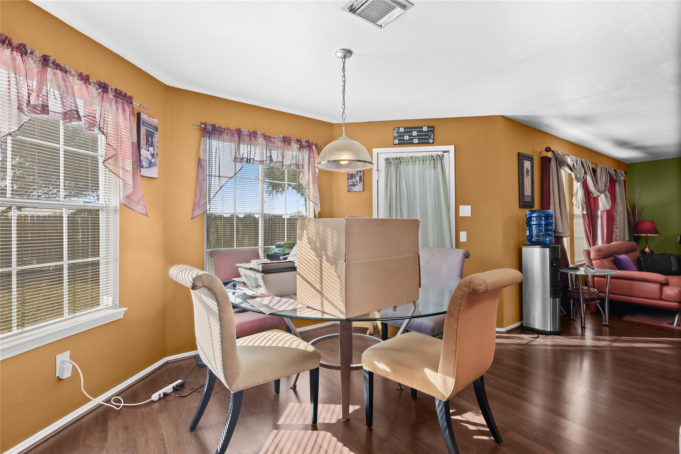 3743 Brighton Springs Lane Katy, TX 77449 - Photo 14 of 40 a view of a dining room with furniture window and wooden floor