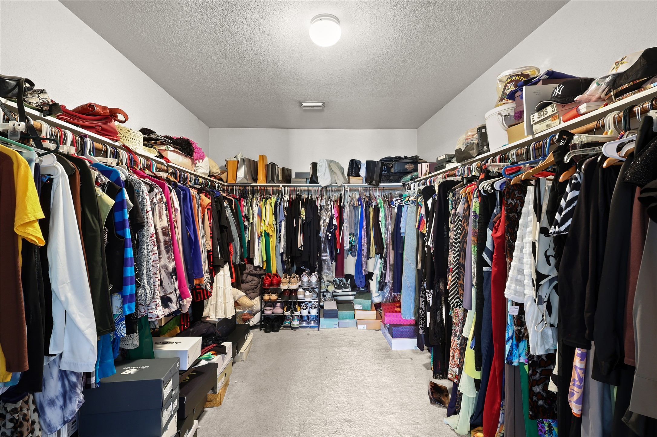 3743 Brighton Springs Lane Katy, TX 77449 - Photo 20 of 40 a view of walk in closet with clothes