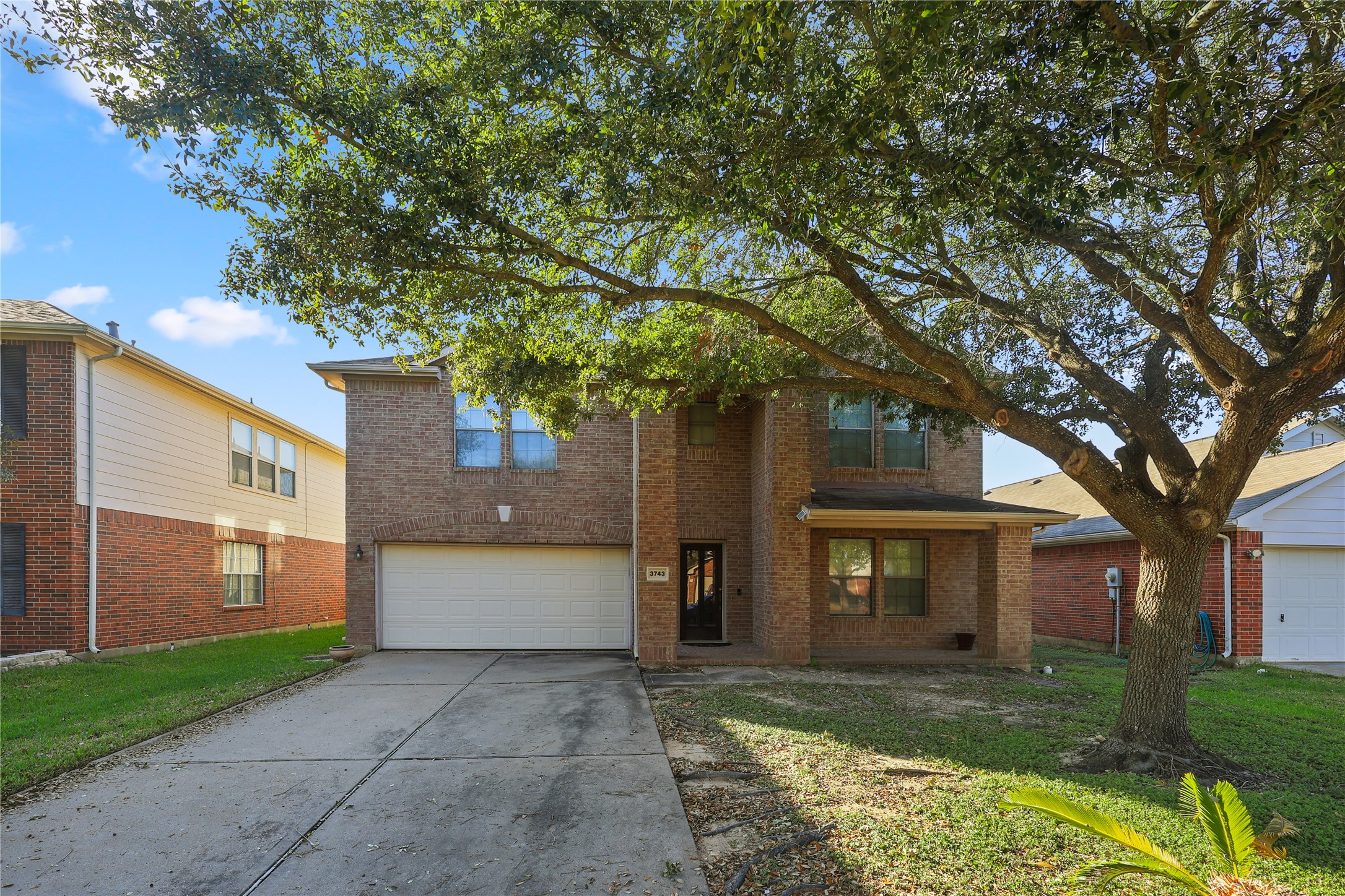 3743 Brighton Springs Lane Katy, TX 77449 - Photo 2 of 40 a front view of a house with a yard and garage
