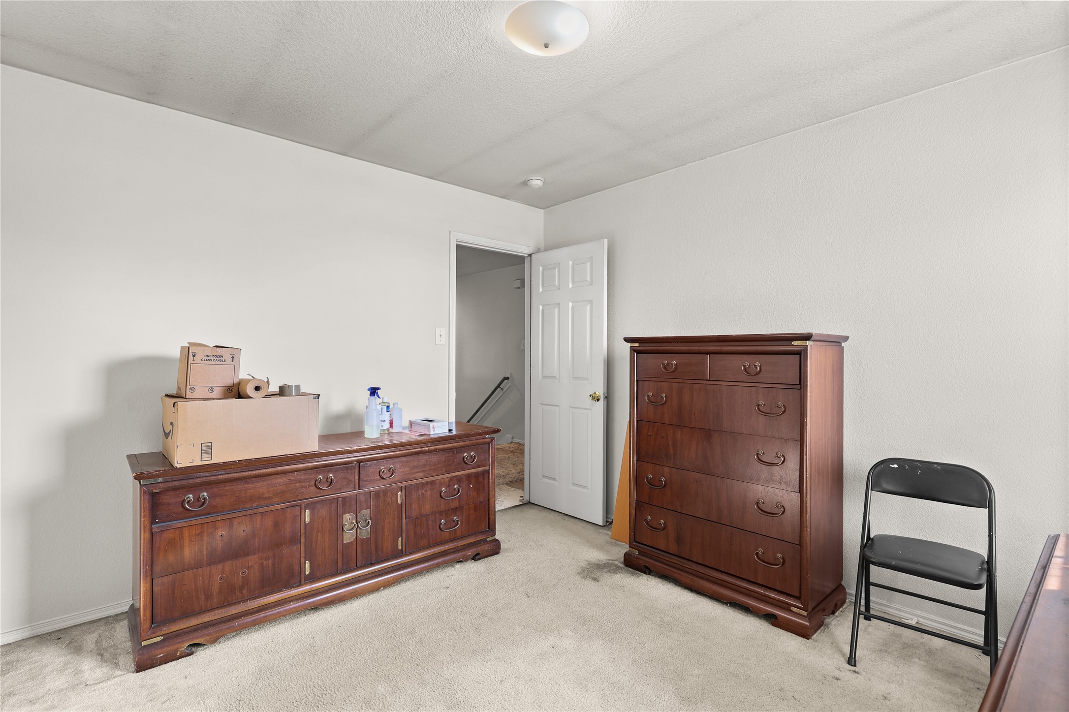 3743 Brighton Springs Lane Katy, TX 77449 - Photo 22 of 40 a room with a dresser and a chair