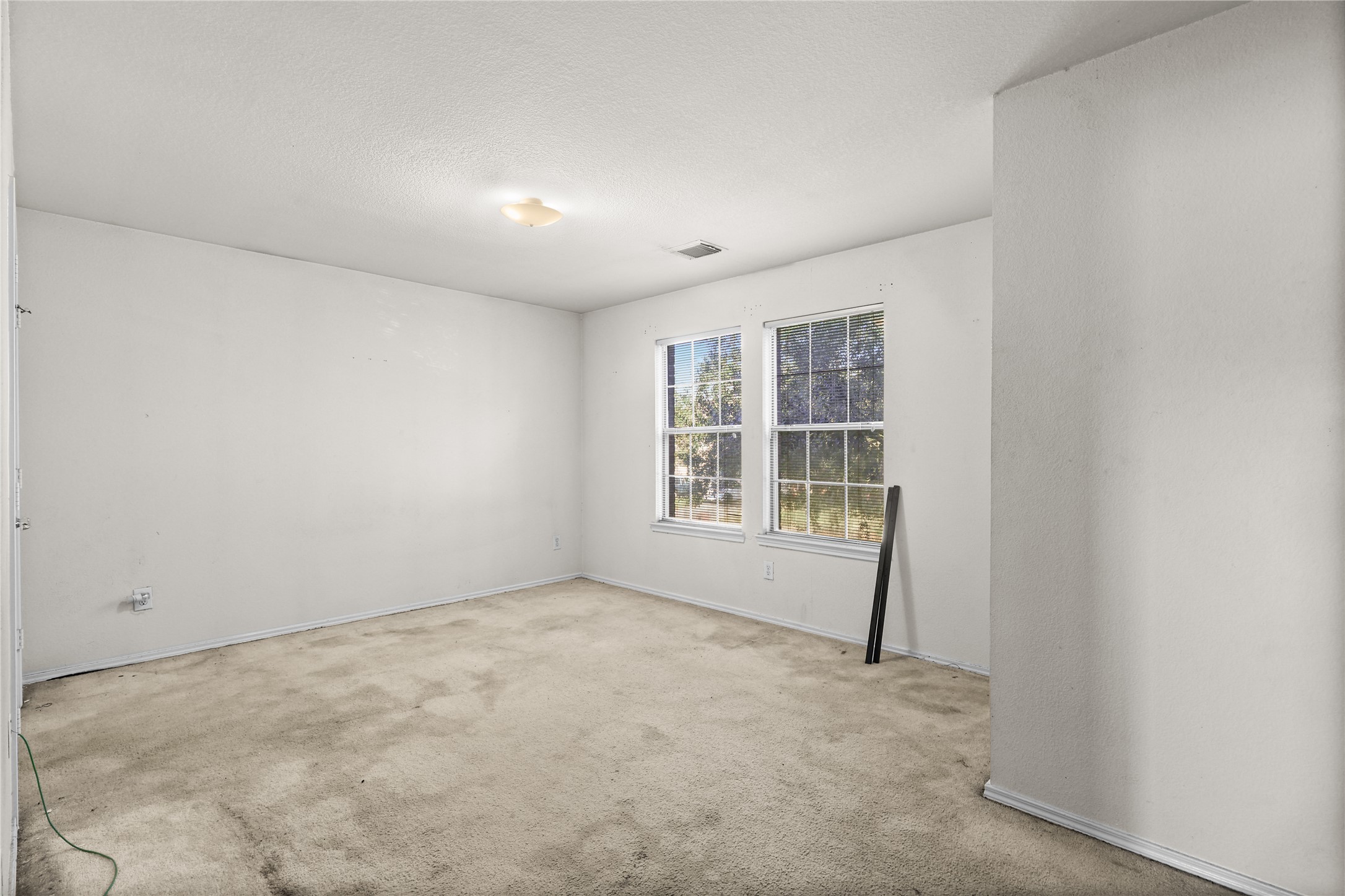 3743 Brighton Springs Lane Katy, TX 77449 - Photo 25 of 40 an empty room with a empty space and windows