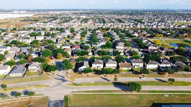 an aerial view of house with yard