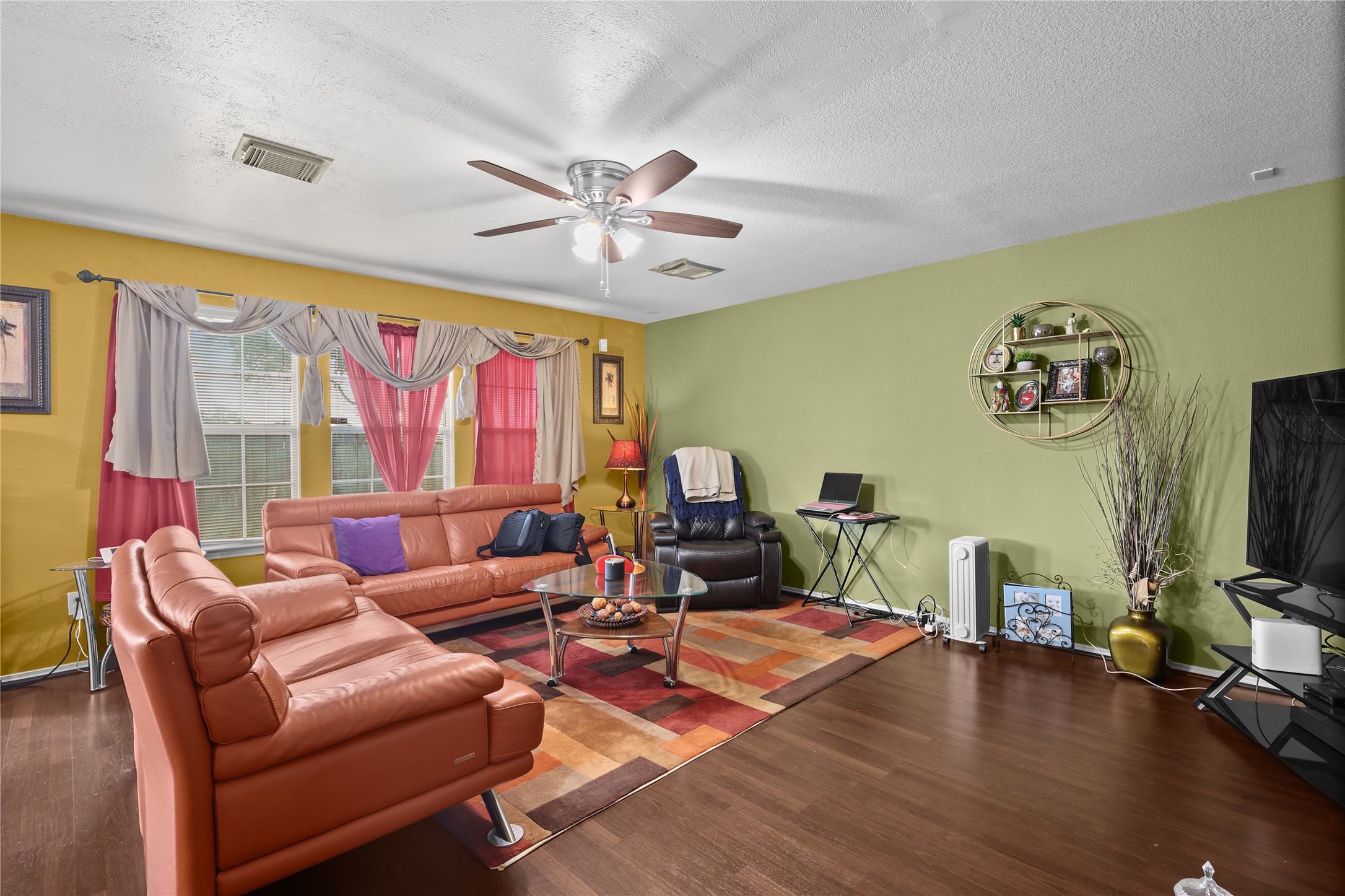 3743 Brighton Springs Lane Katy, TX 77449 - Photo 7 of 40 a living room with furniture a flat screen tv and a large window
