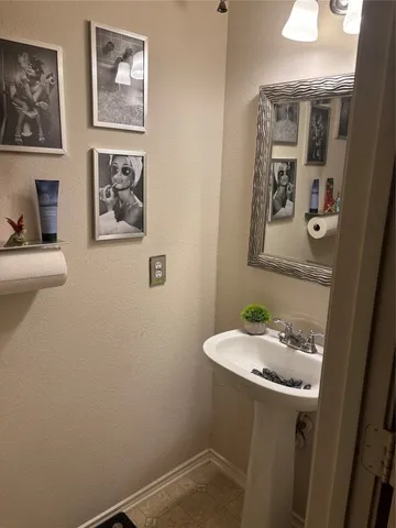 a bathroom with a sink and mirror