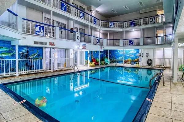 a view of swimming pool with outdoor seating