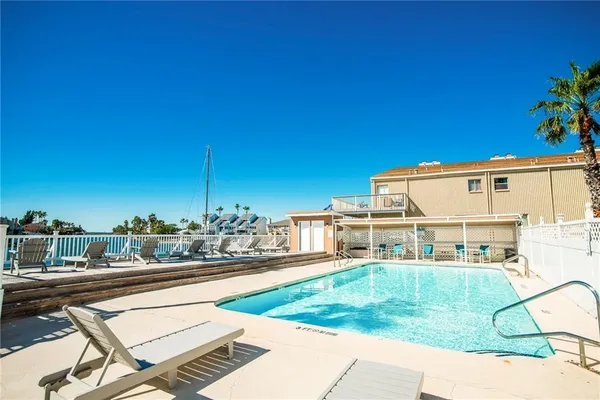 a view of a swimming pool with a patio