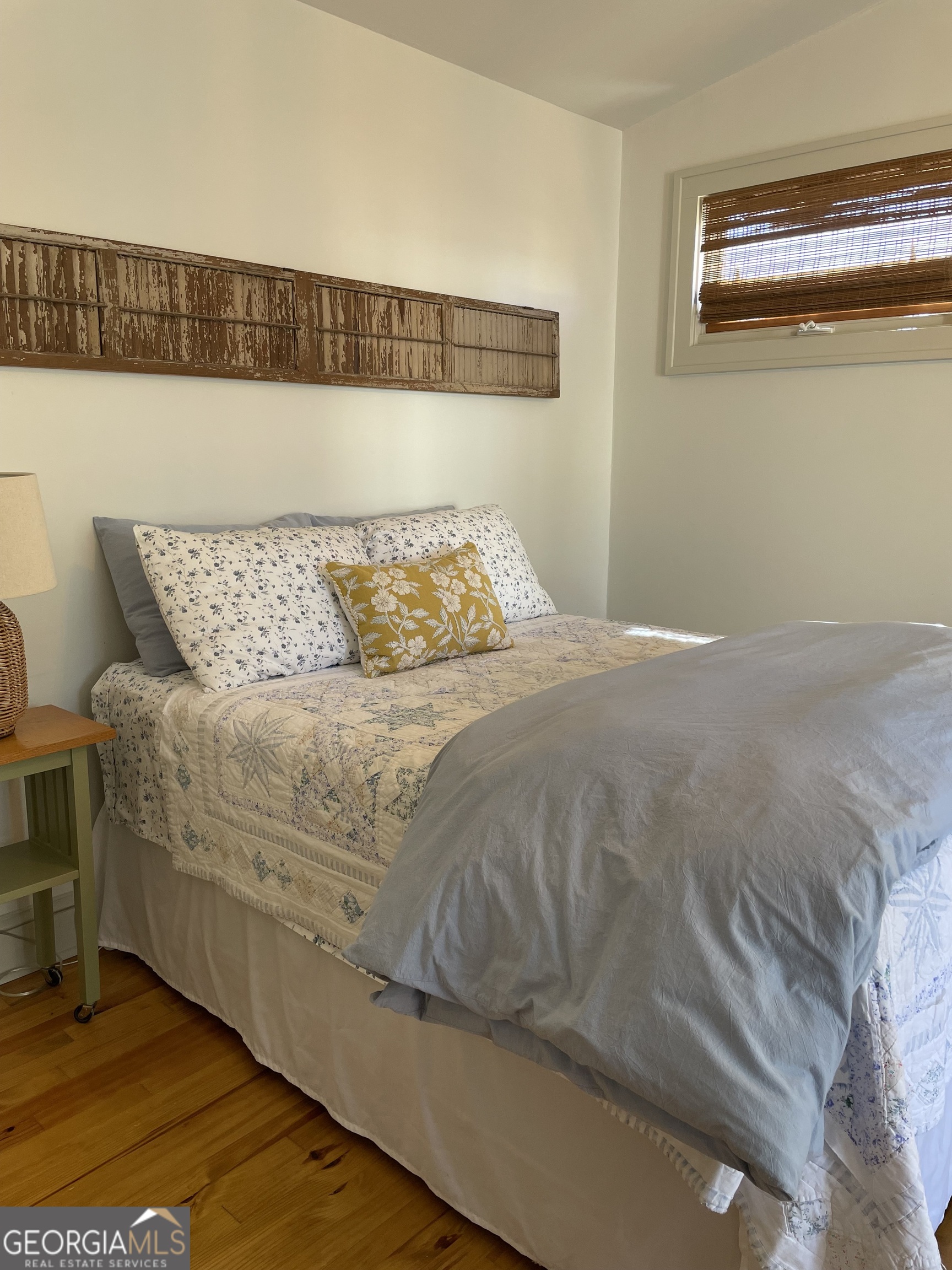 200 South Jackson Street Hartwell, GA 30643 - Photo 15 of 26 a bedroom with a bed and painting on the wall