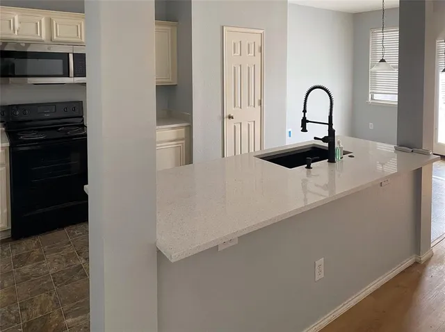 a close view of a kitchen counter space with stove