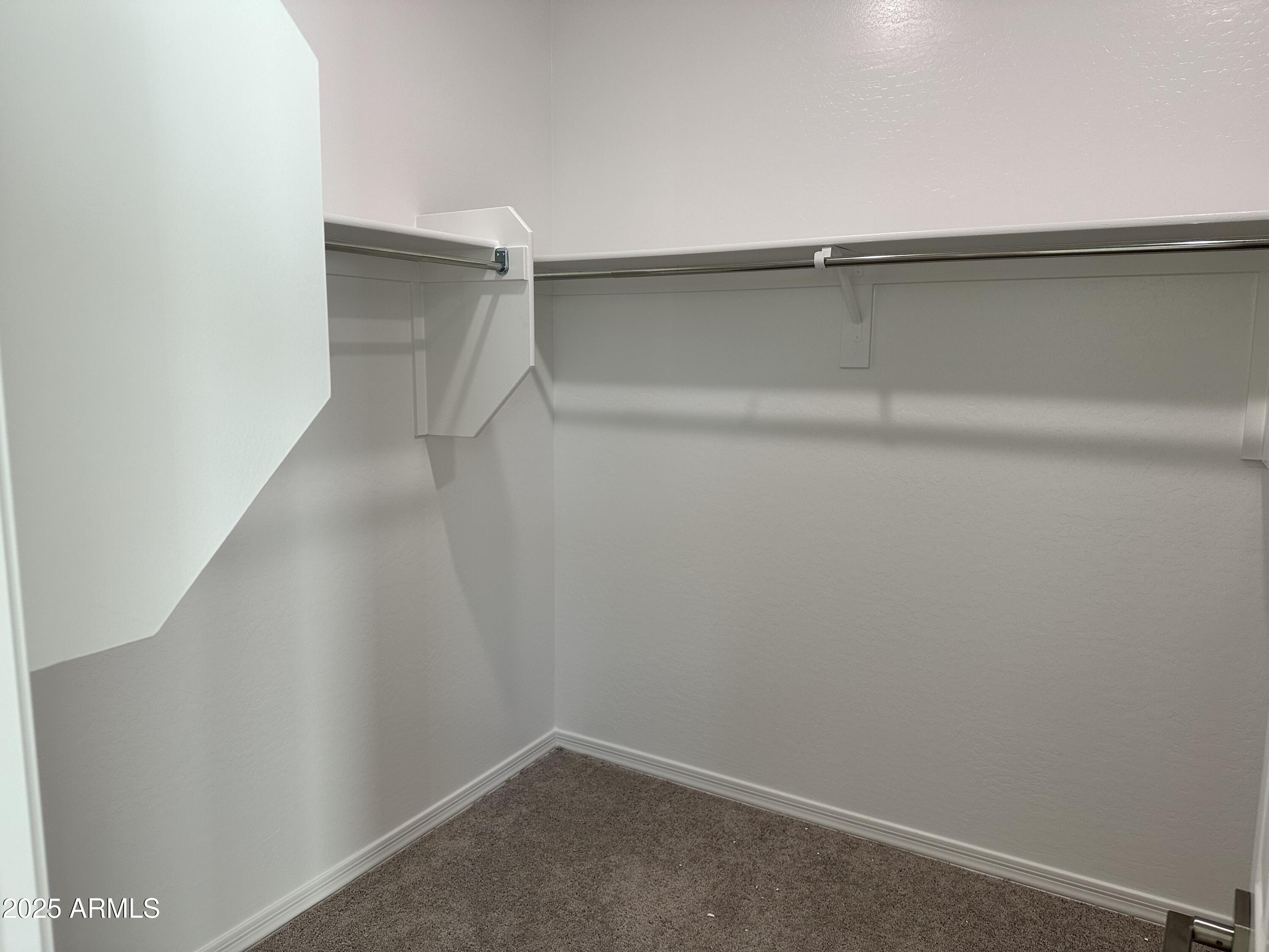 5607 West Summerside Road Laveen, AZ 85339 - Photo 33 of 49 0020_ Primary walk in closet