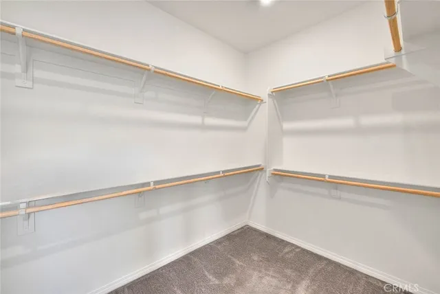 a bathroom with double sink and a mirror