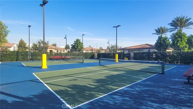 a view of swimming pool with outdoor seating and city view