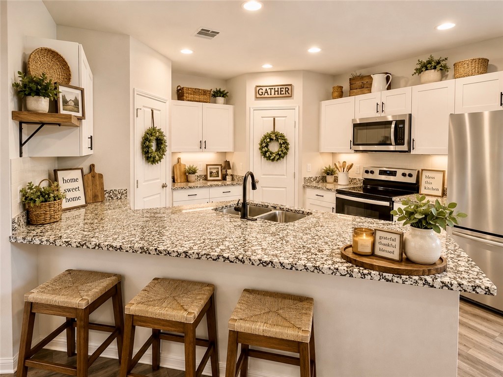 137 Windmill Road Somerville, TX 77879 - Photo 3 of 17 a kitchen with stainless steel appliances granite countertop a sink and cabinets