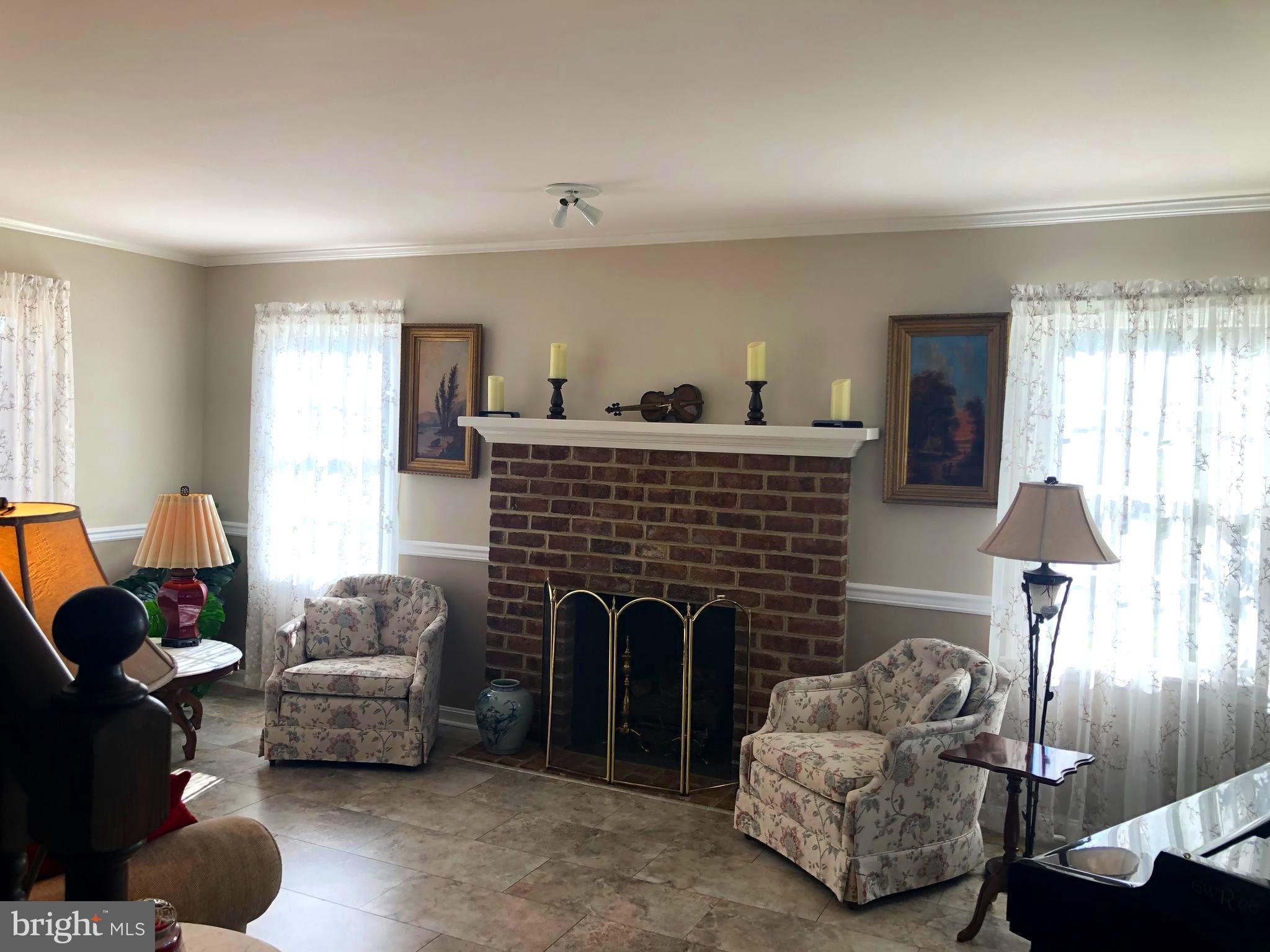 5 Orion Road Boiling Springs, PA 17007 - Photo 7 of 13 With bunches of ambient light enjoy the fireplace.