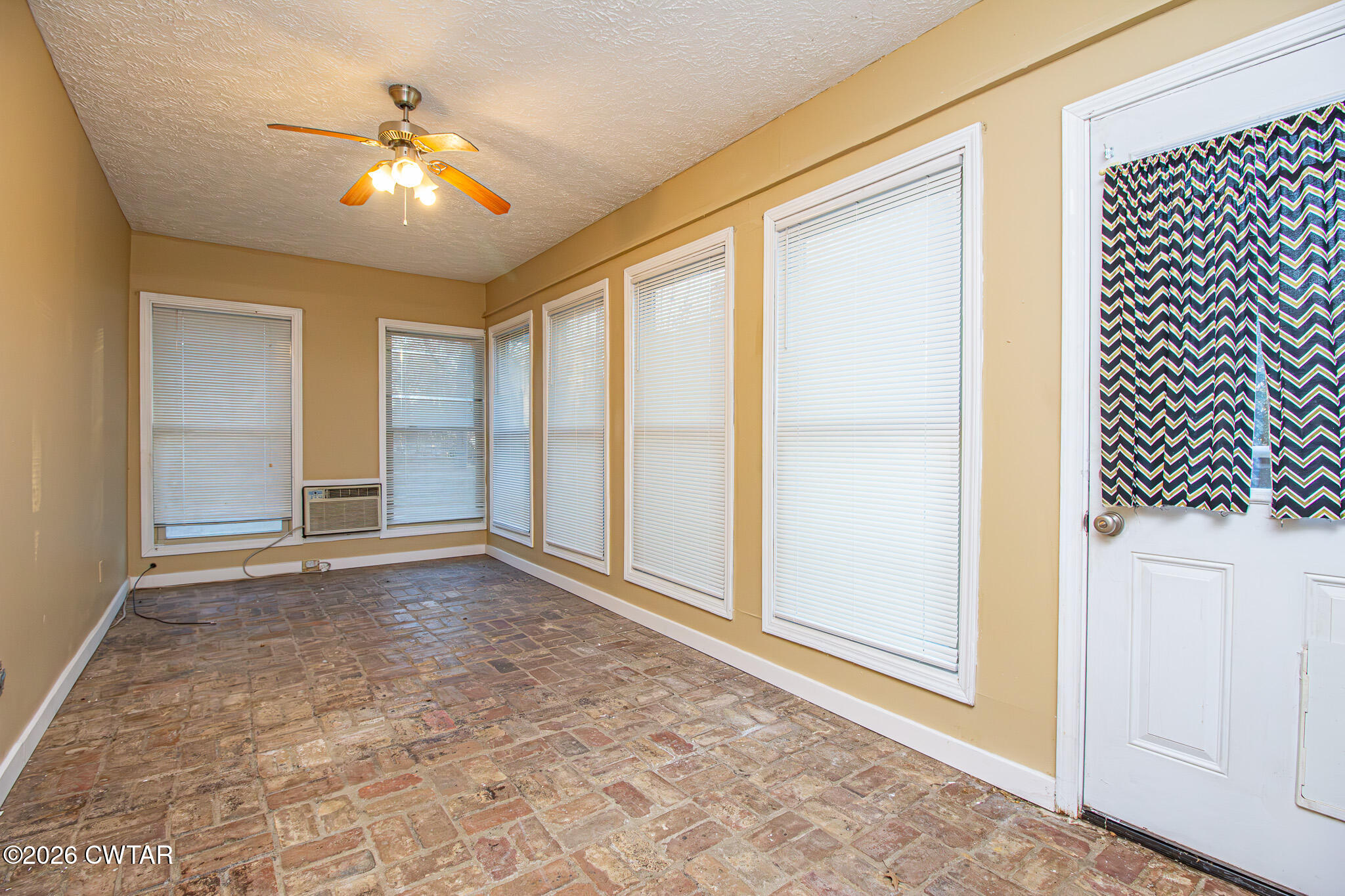 231 Tuckahoe Road Jackson, TN 38305 - Photo 18 of 39 an empty room with windows and yard