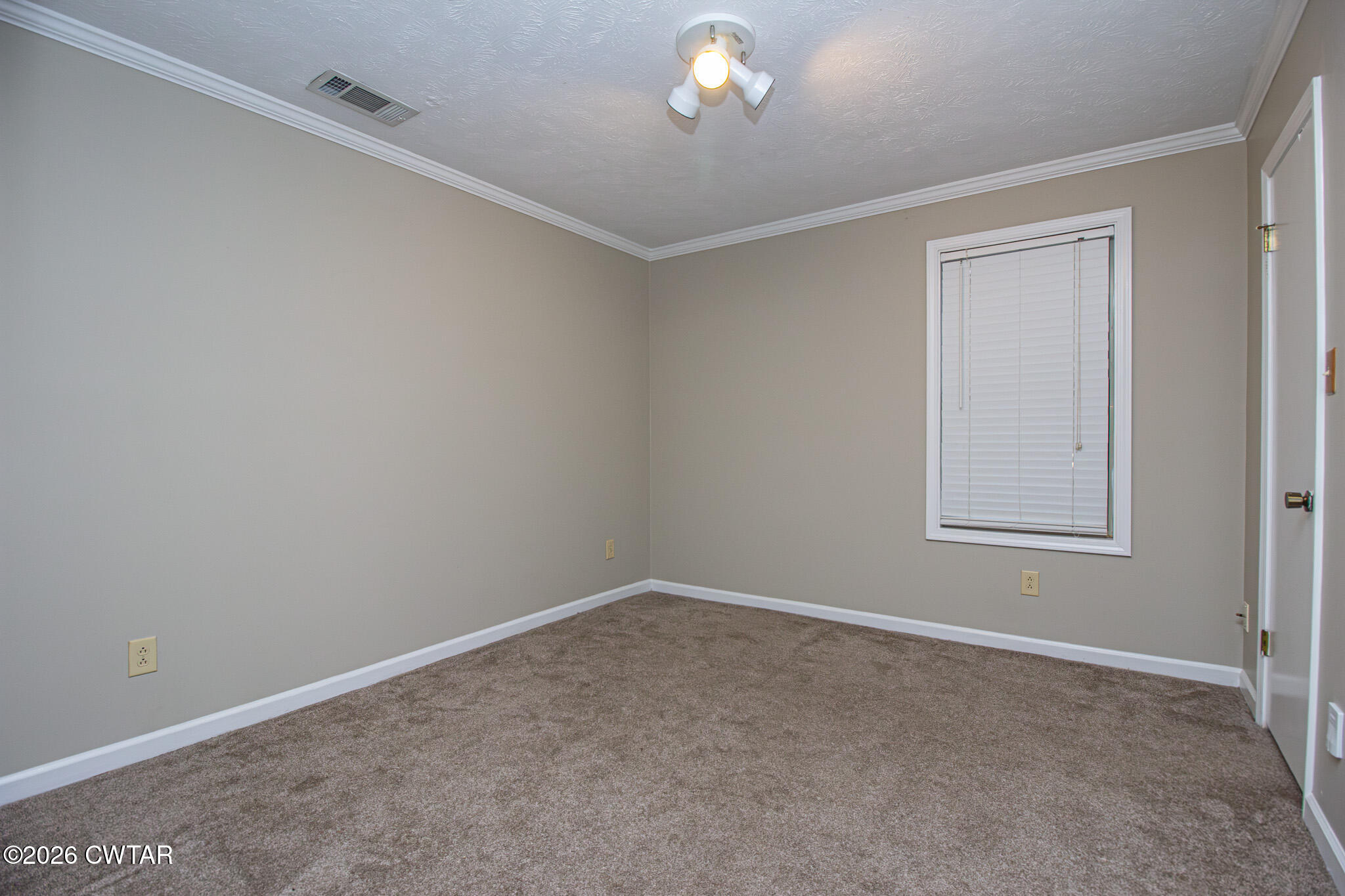 231 Tuckahoe Road Jackson, TN 38305 - Photo 24 of 39 a view of an empty room with a window