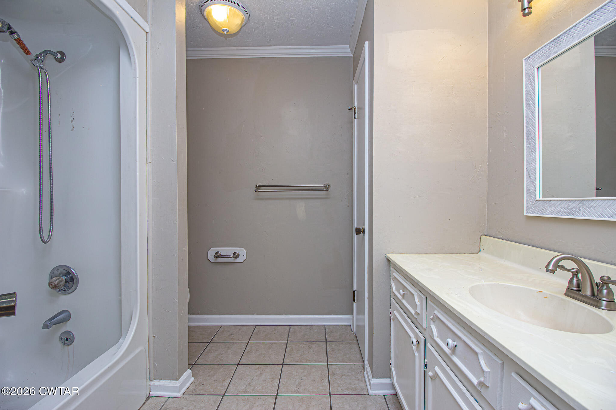 231 Tuckahoe Road Jackson, TN 38305 - Photo 27 of 39 a bathroom with a sink a toilet and shower