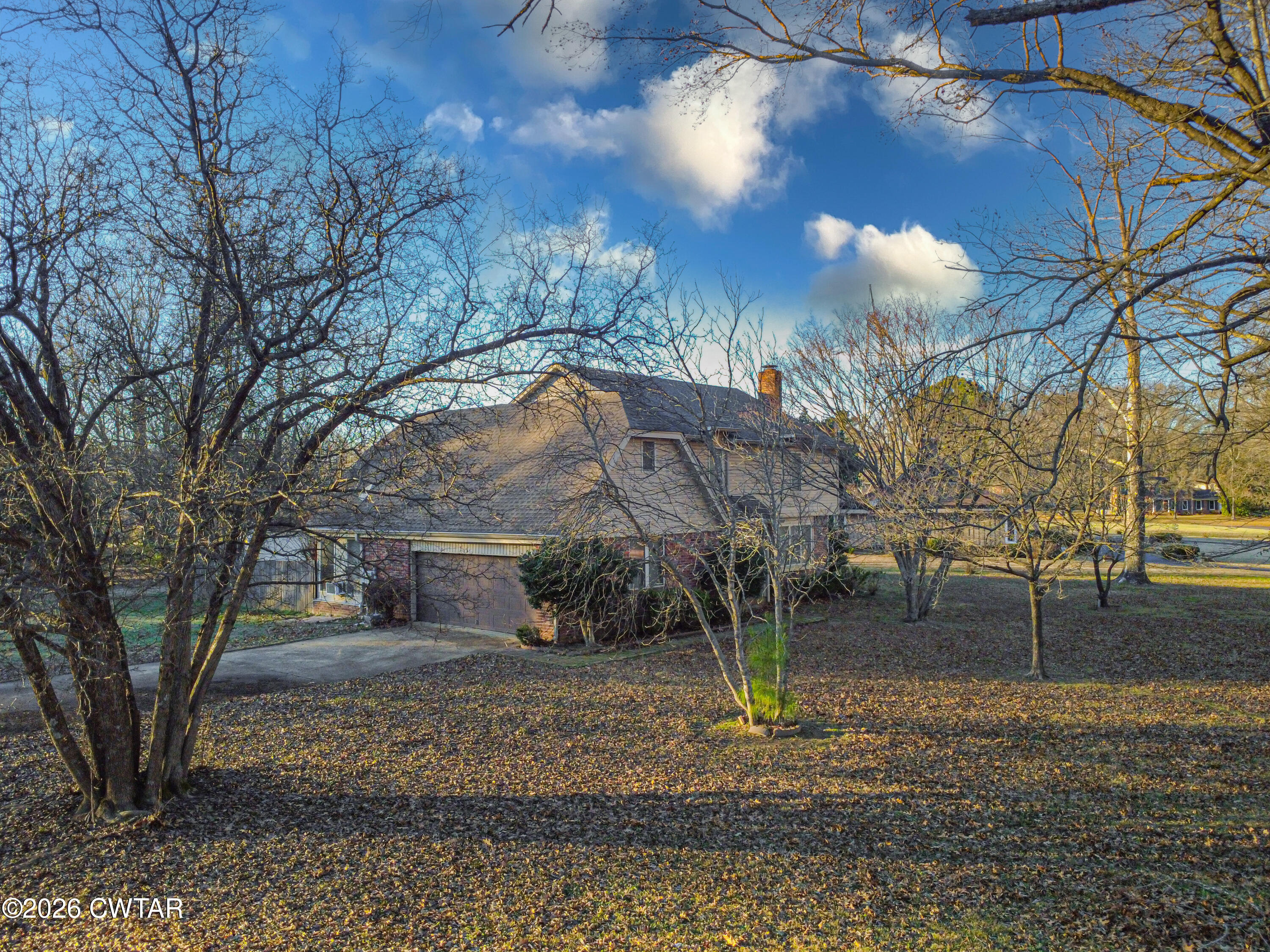 231 Tuckahoe Road Jackson, TN 38305 - Photo 37 of 39 a view of a yard with a tree