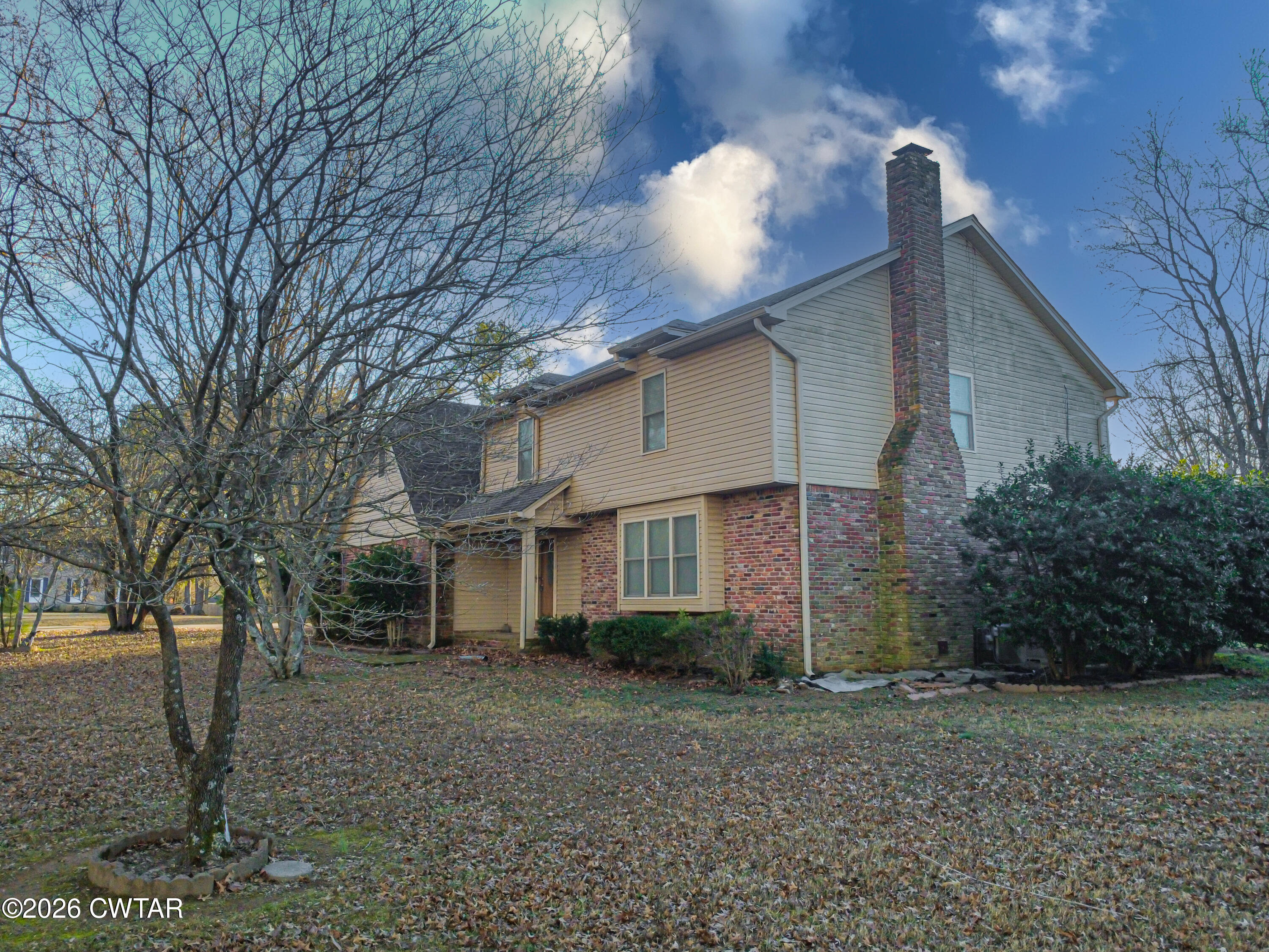 231 Tuckahoe Road Jackson, TN 38305 - Photo 5 of 39 a house that has a tree in front of it