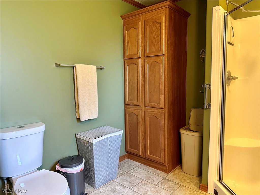 100 Anderson Road Fleming, OH 45729 - Photo 17 of 31 Second view of master bathroom, showing additional storage cabinet and stand-up shower.