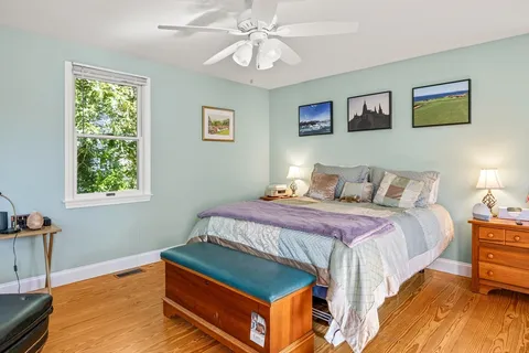 a bathroom with a granite countertop sink and a large mirror