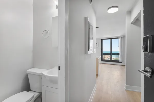 a bathroom with a toilet sink and tub