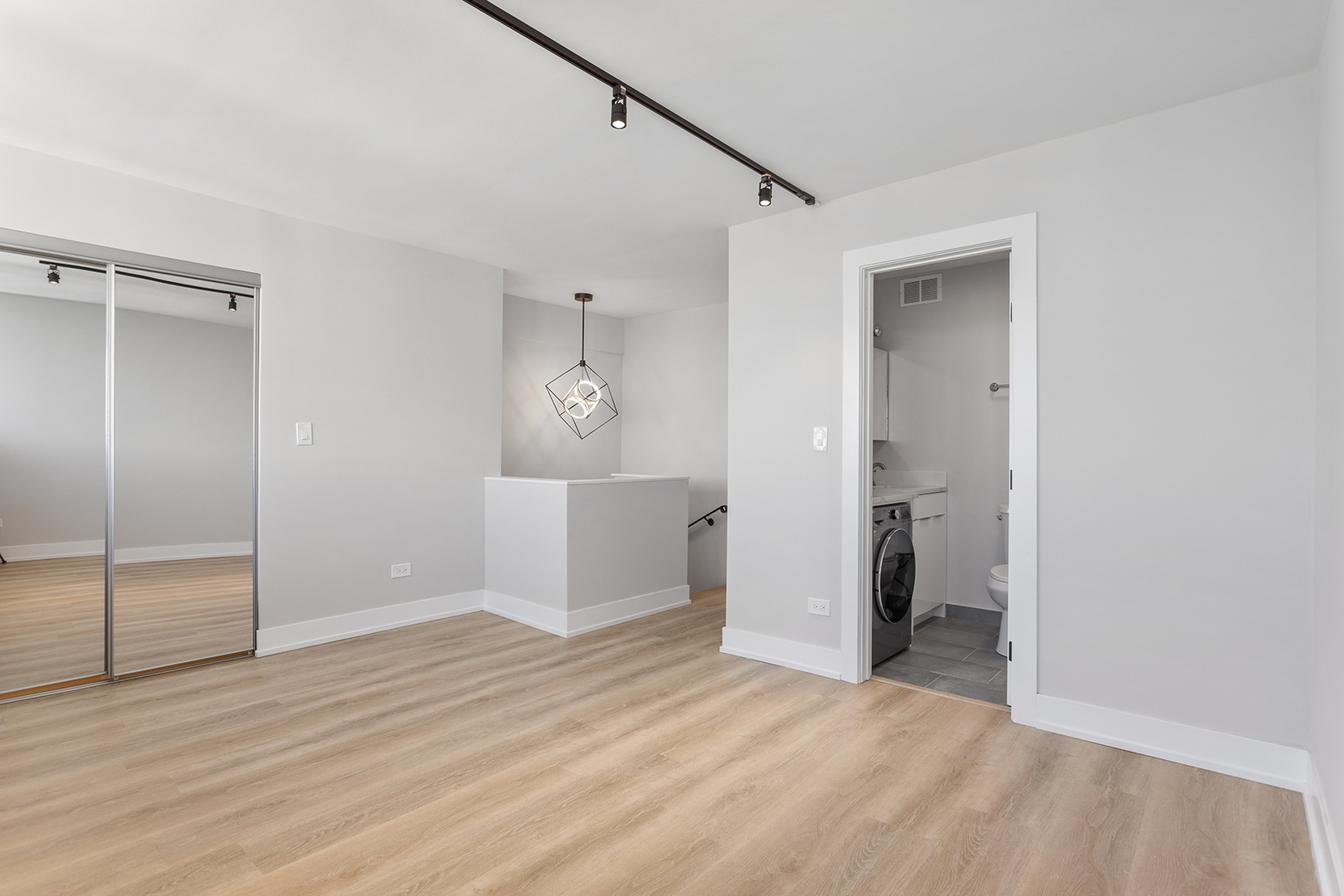 6166 North Sheridan Road, Unit 26D Chicago, IL 60660 - Photo 7 of 17 a view of a room with wooden floor cabinet and closet