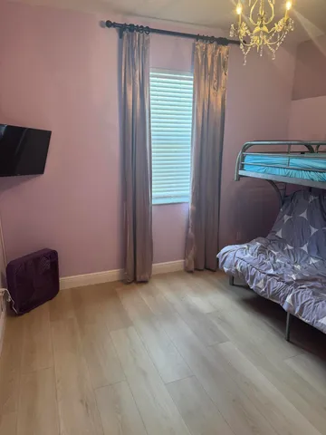 a room that has a bed and a chair in it