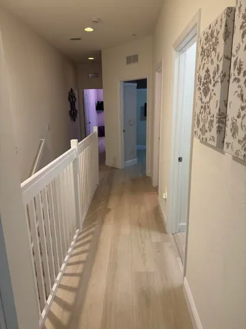 a view of a hallway with entryway