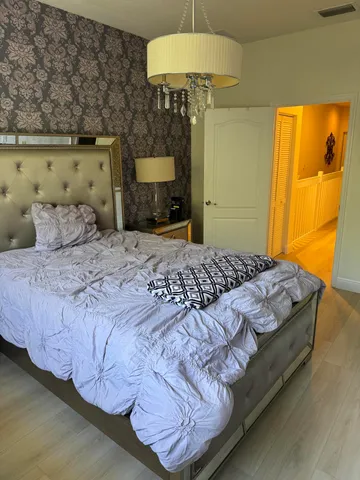 a bedroom with a bed and a table