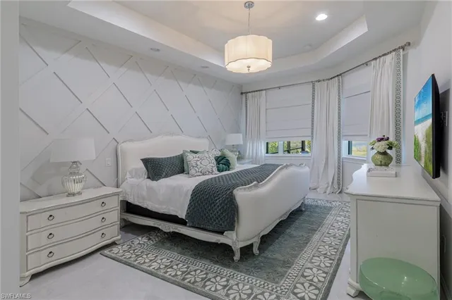 a spacious bathroom with a granite countertop sink and a mirror