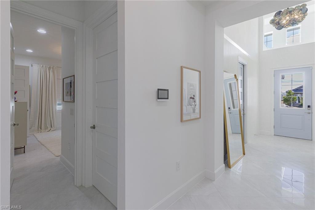 8963 Gustavia Court Naples, FL 34113 - Photo 18 of 47 a view of a livingroom and a bathroom
